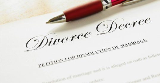 Pen and divorce decree document on desk