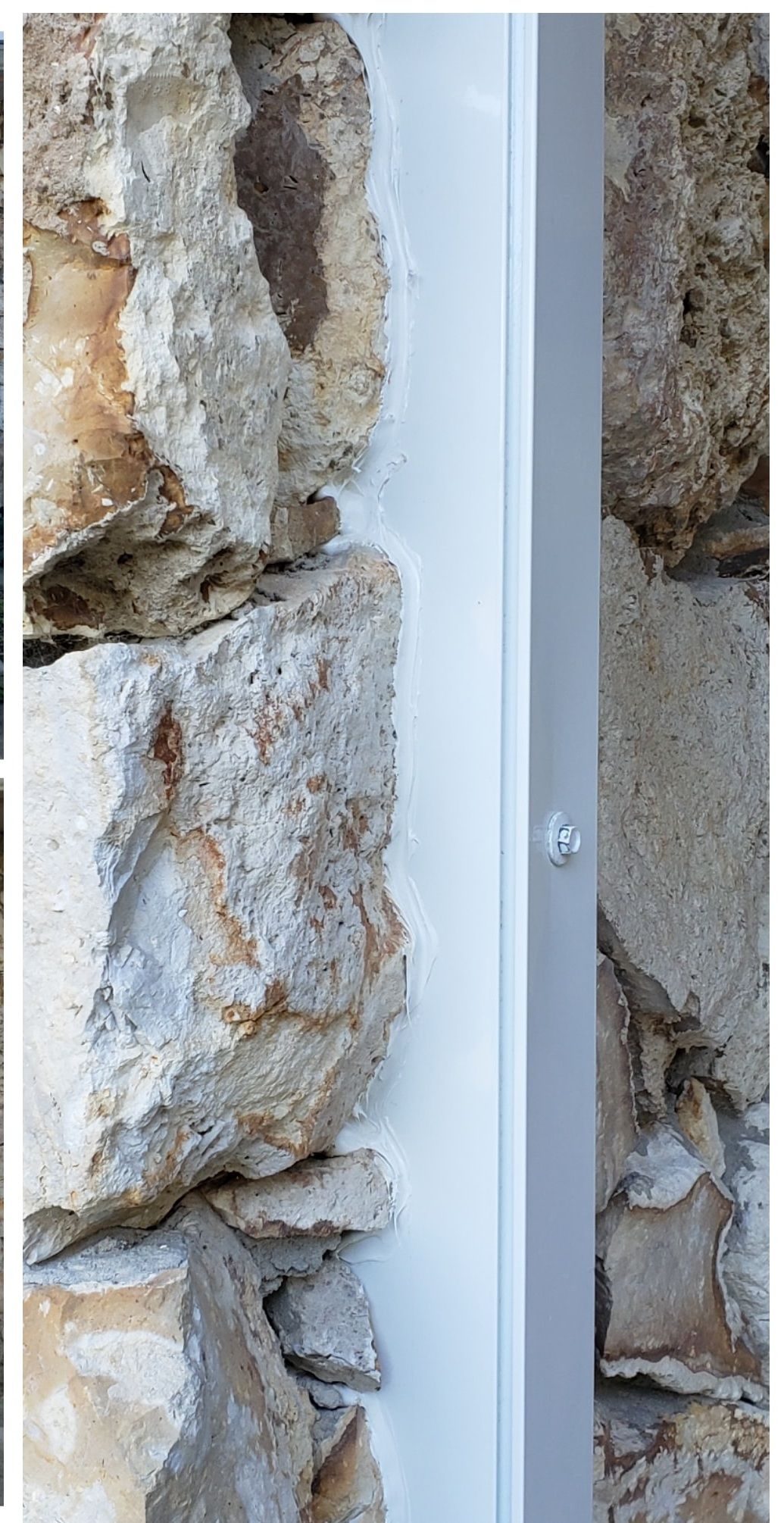 Stone wall with white framing around an adjacent panel.