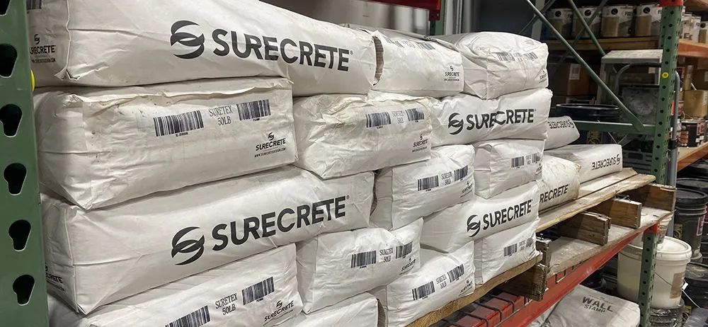A warehouse filled with lots of bags of surecrete.