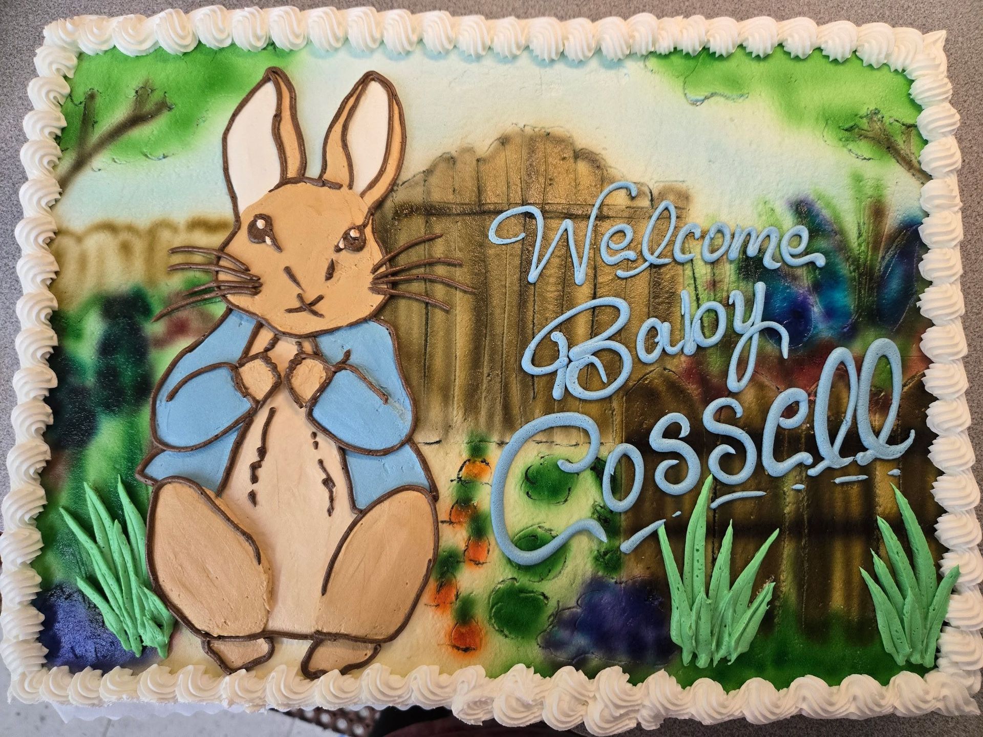 Peter Rabbit cake with Welcome Baby Cossell and garden scene.