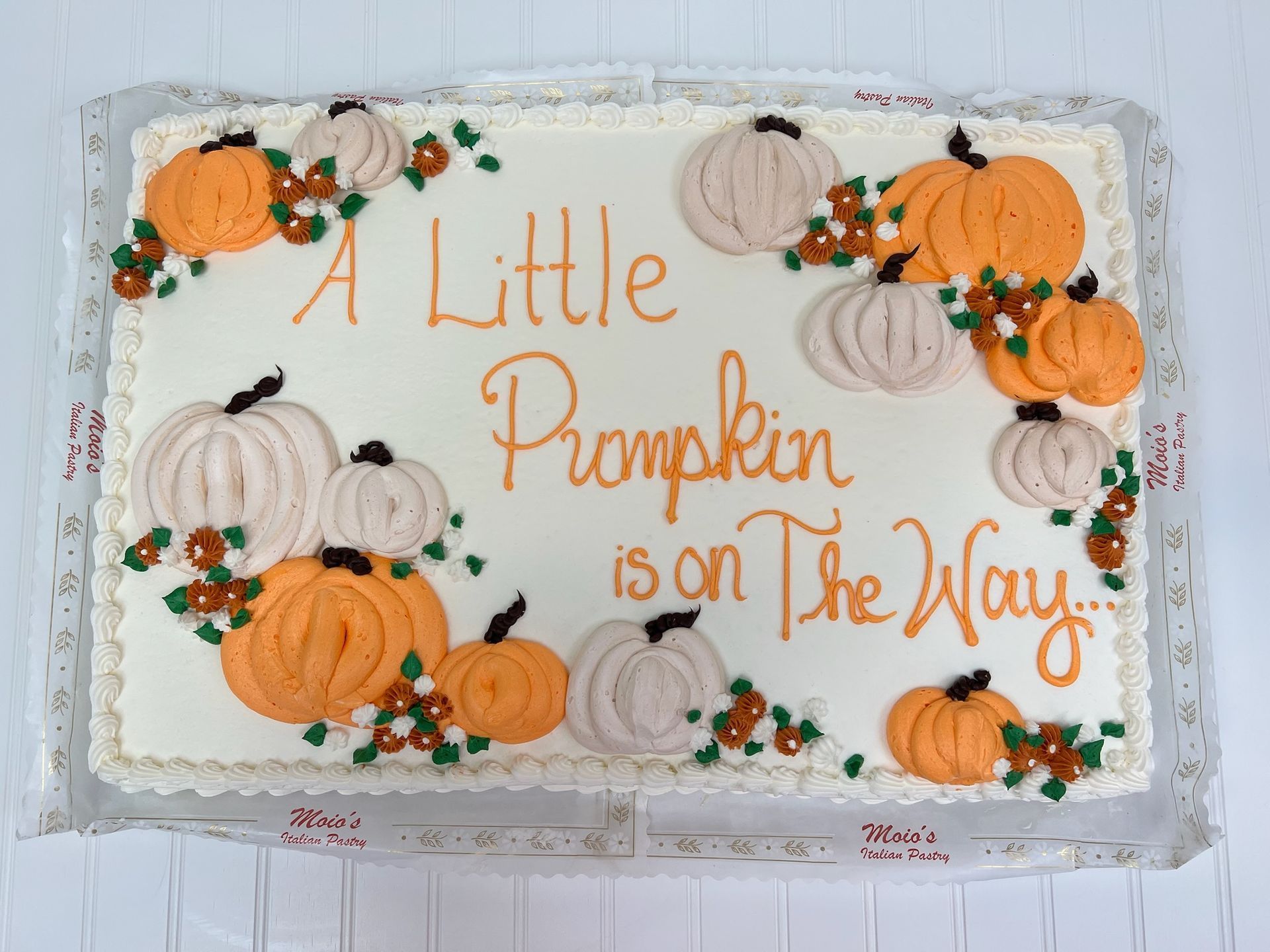 Cake decorated with pumpkins and text