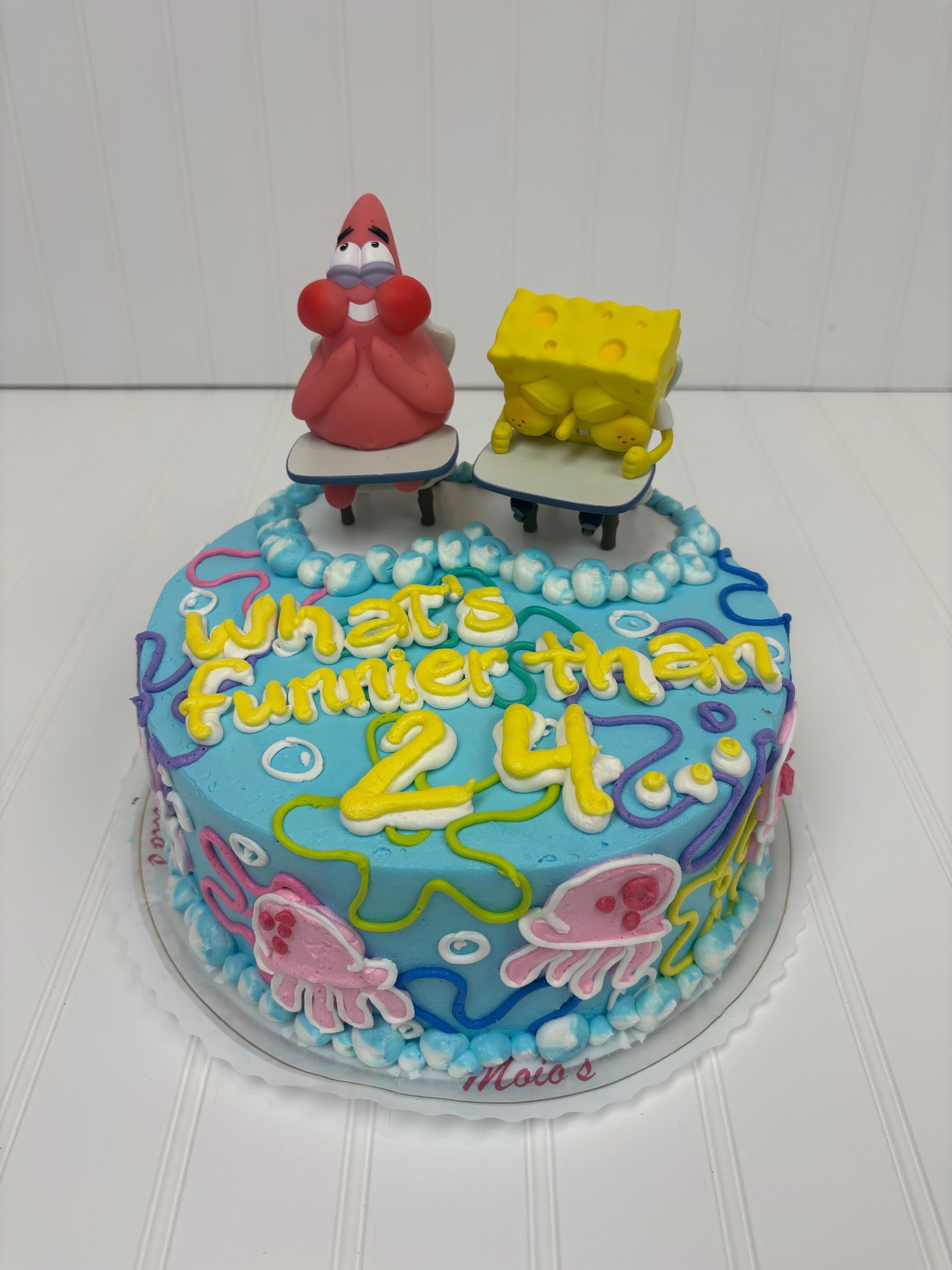SpongeBob birthday cake with Patrick, SpongeBob, blue frosting, and sea creatures.