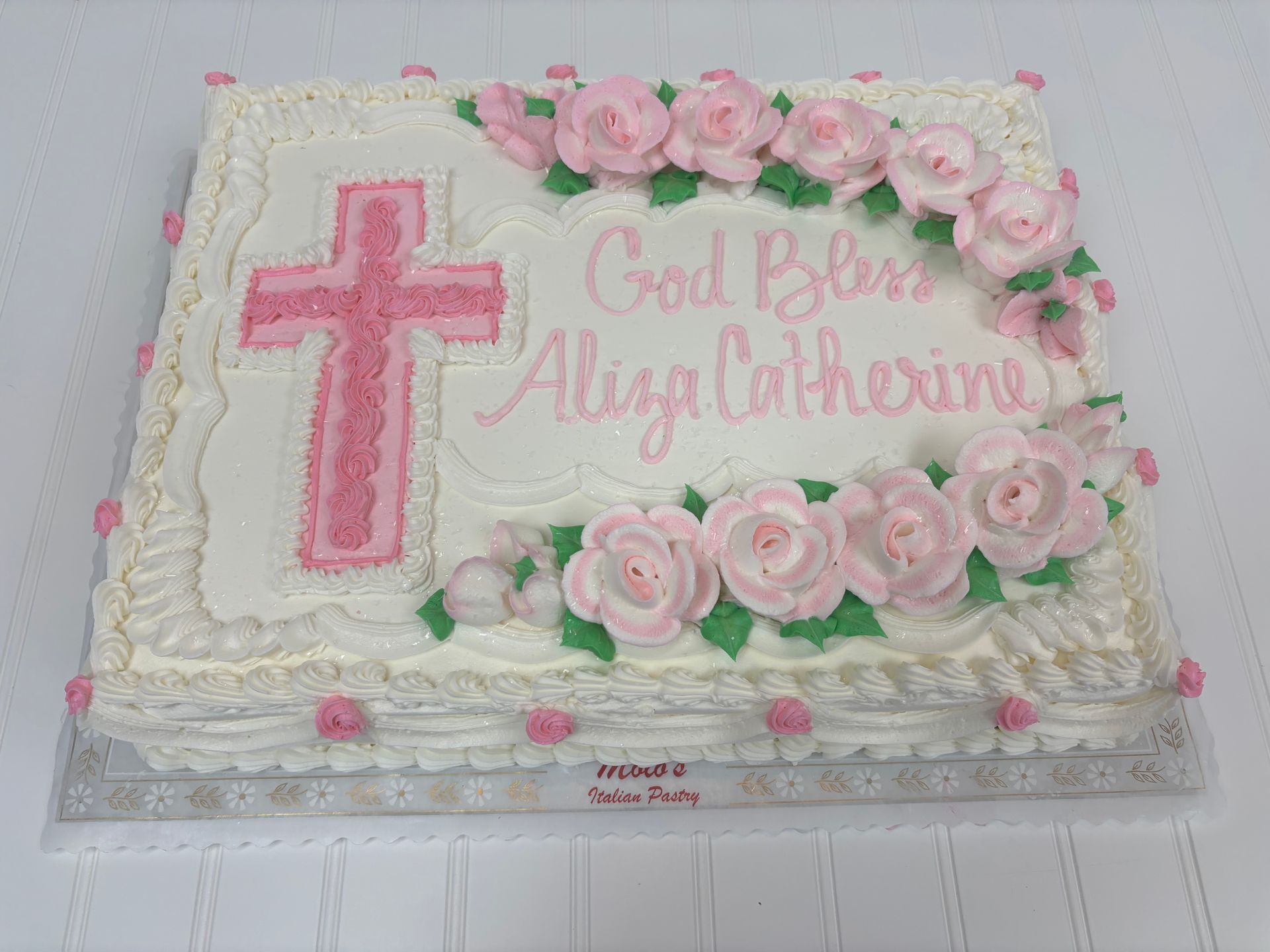 Pink cross cake with roses