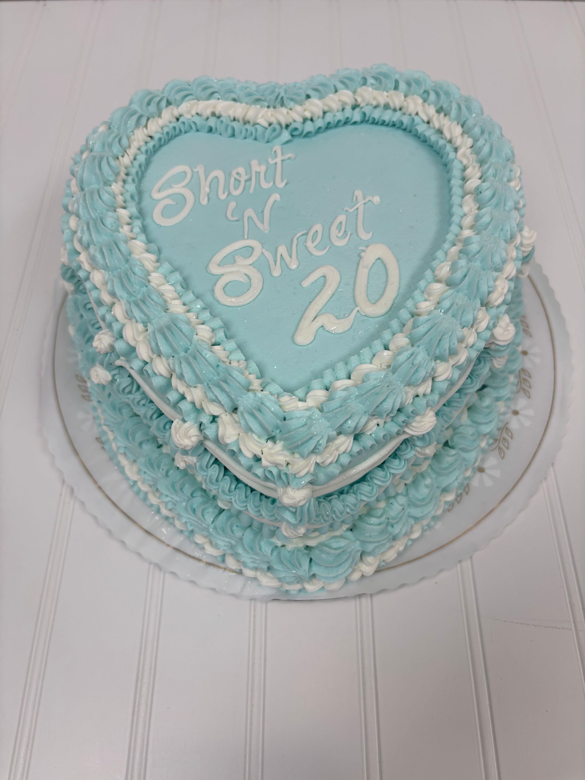 Heart-shaped cake with light blue frosting