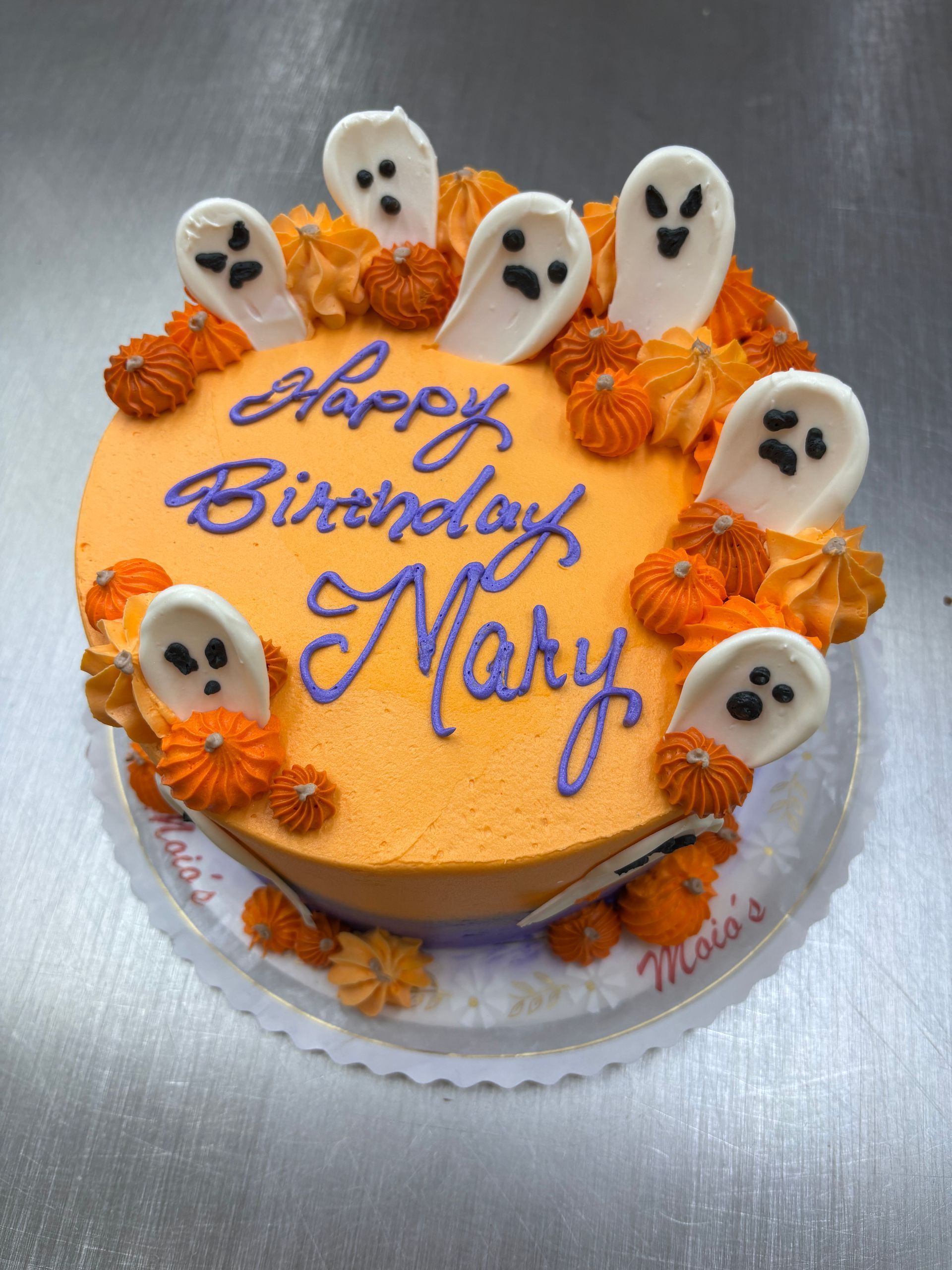Orange Halloween-themed birthday cake with