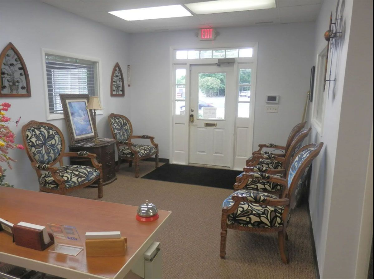 Giggie's Bonding, LLC's waiting room with comfortable chairs