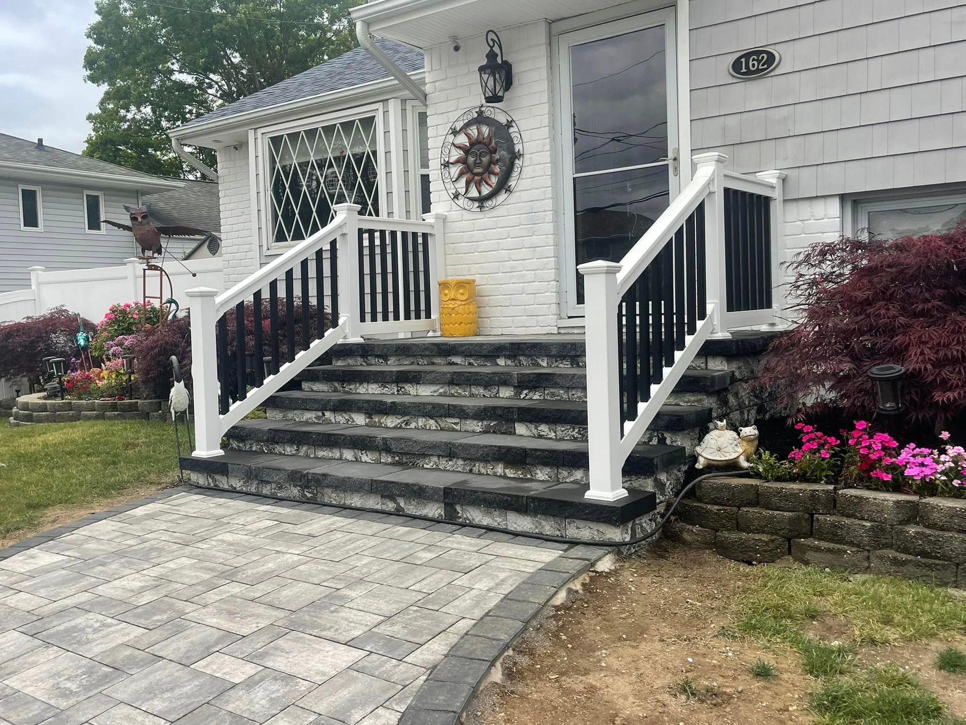 Front door stairs with white and black star case