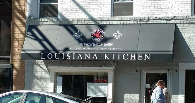 Louisiana Kitchen restaurant with a black awning and storefront.