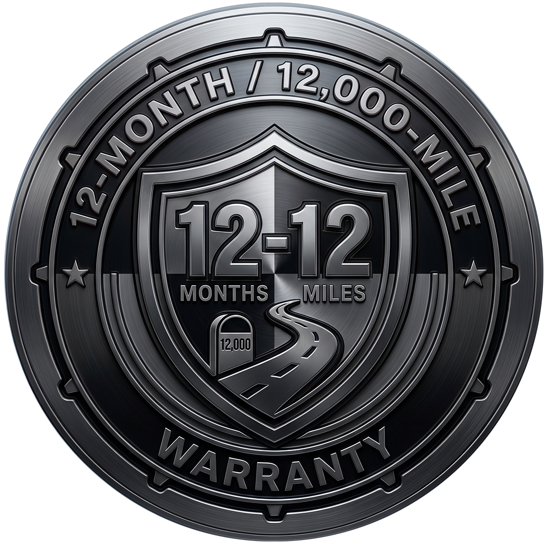 Black warranty badge reading 12-12 months/miles and 12-month/12,000-mile warranty