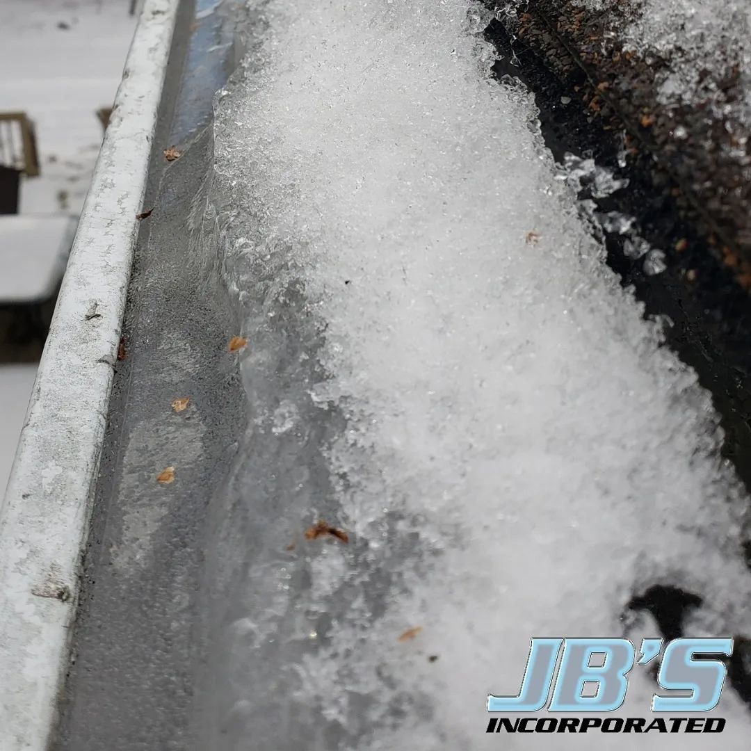 A close up of a gutter with jb 's incorporated written on the bottom