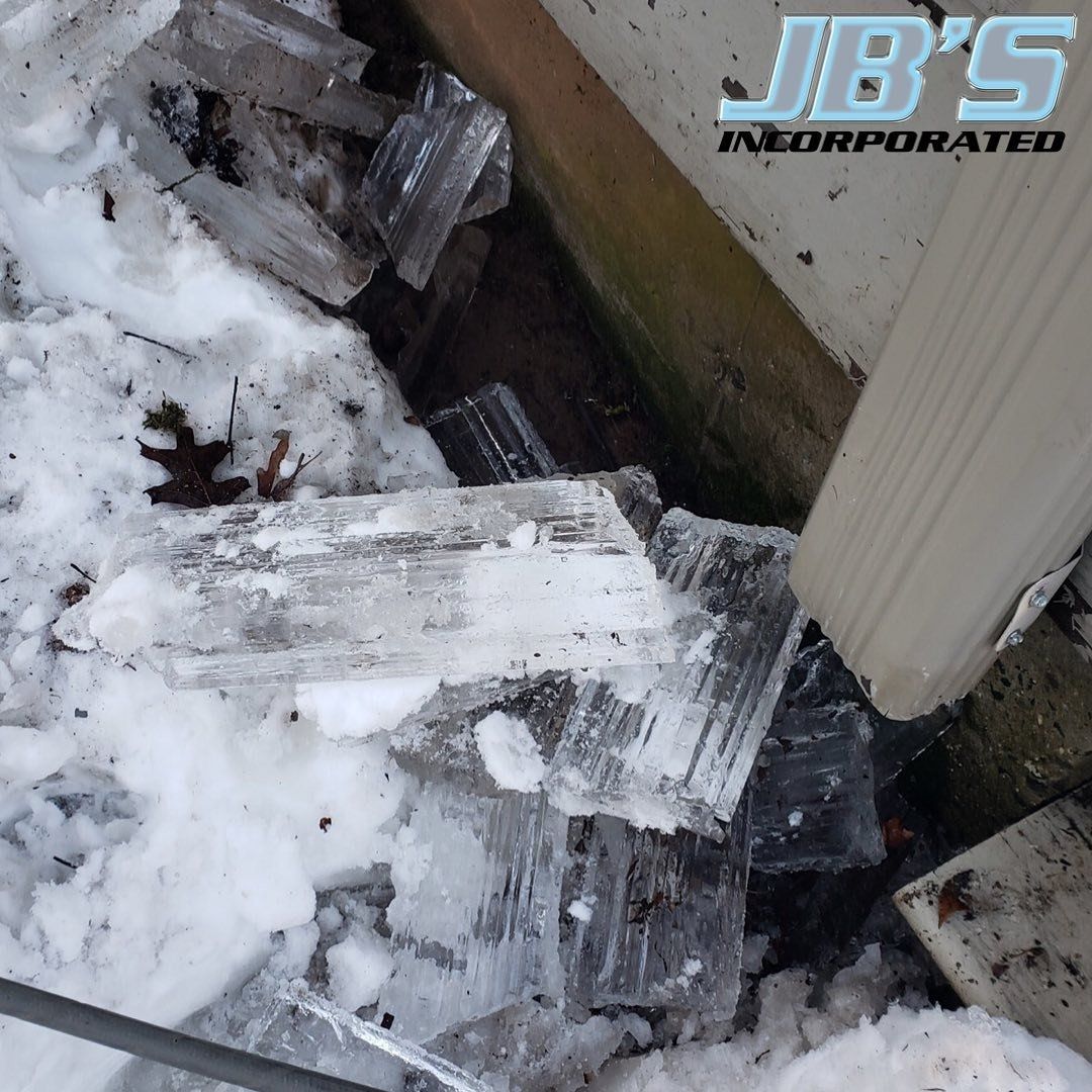 A jb 's logo is on a snowy surface