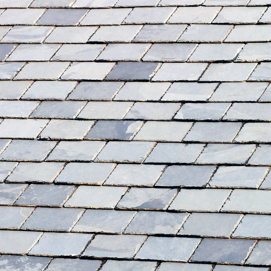 A close up of a roof made of slate tiles.