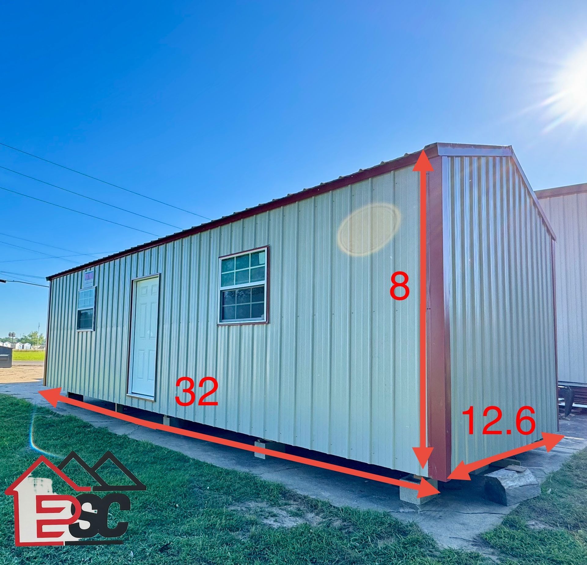 A picture of a metal building with measurements on it.