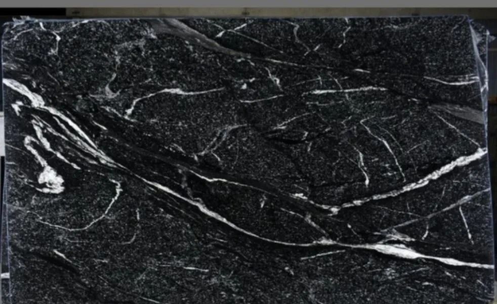 Black granite slab with white veining.