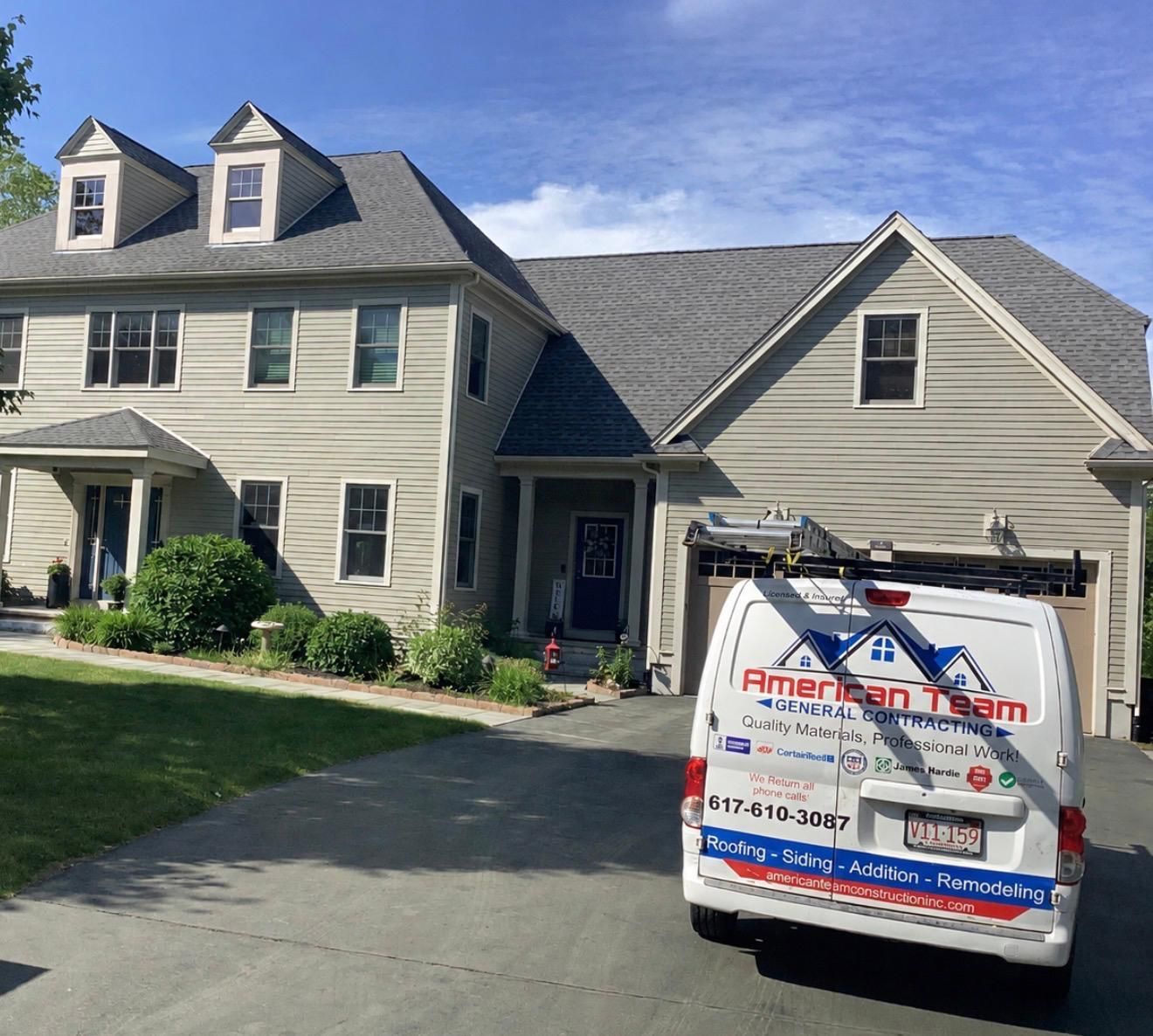 Suburban house with a white van parked in the driveway on a sunny day