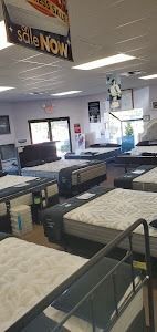 A mattress store filled with lots of mattresses for sale.