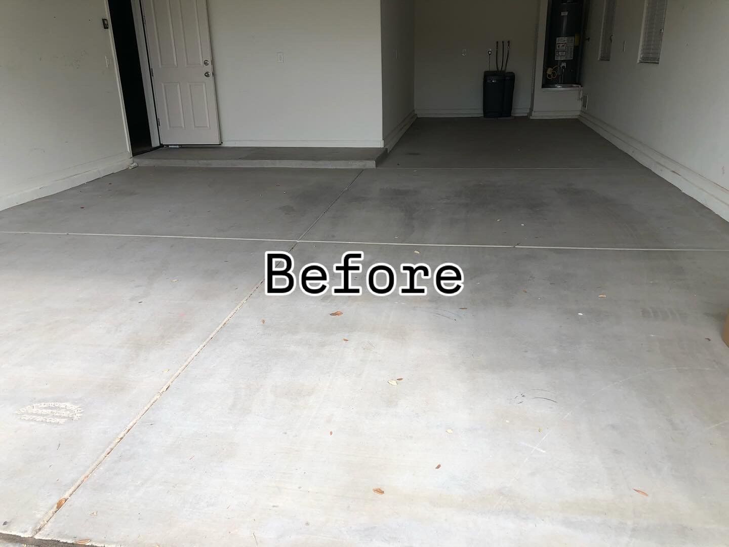 A before picture of a concrete driveway in a garage.