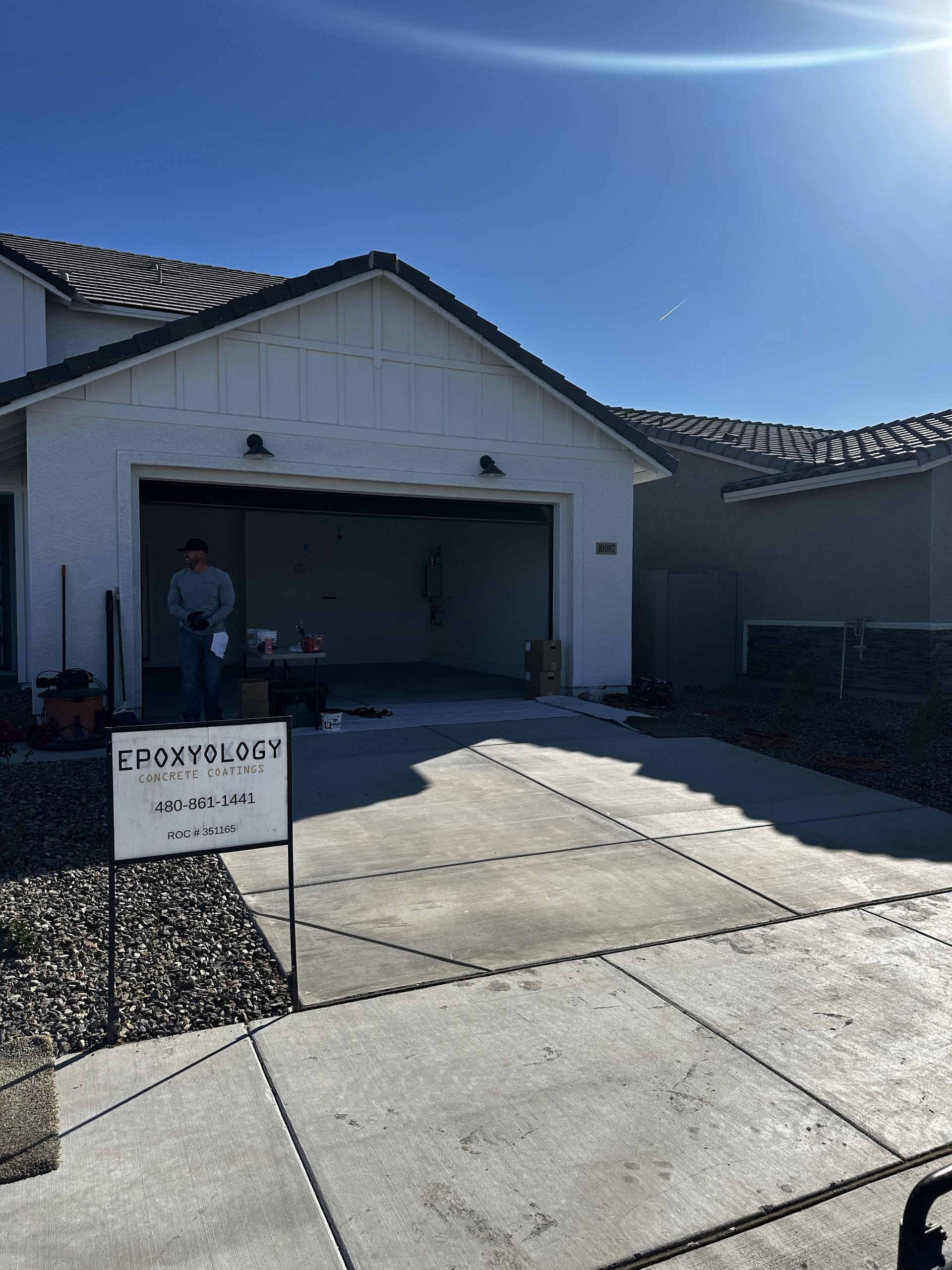 A white house with a sign in front of it that says emergency