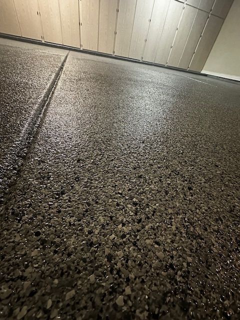 A close up of a concrete floor in a garage.