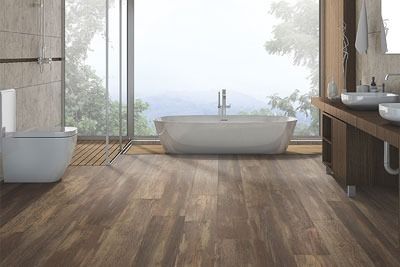 Modern bathroom with wood-look flooring, a freestanding tub, large window with a view, and a floating vanity.
