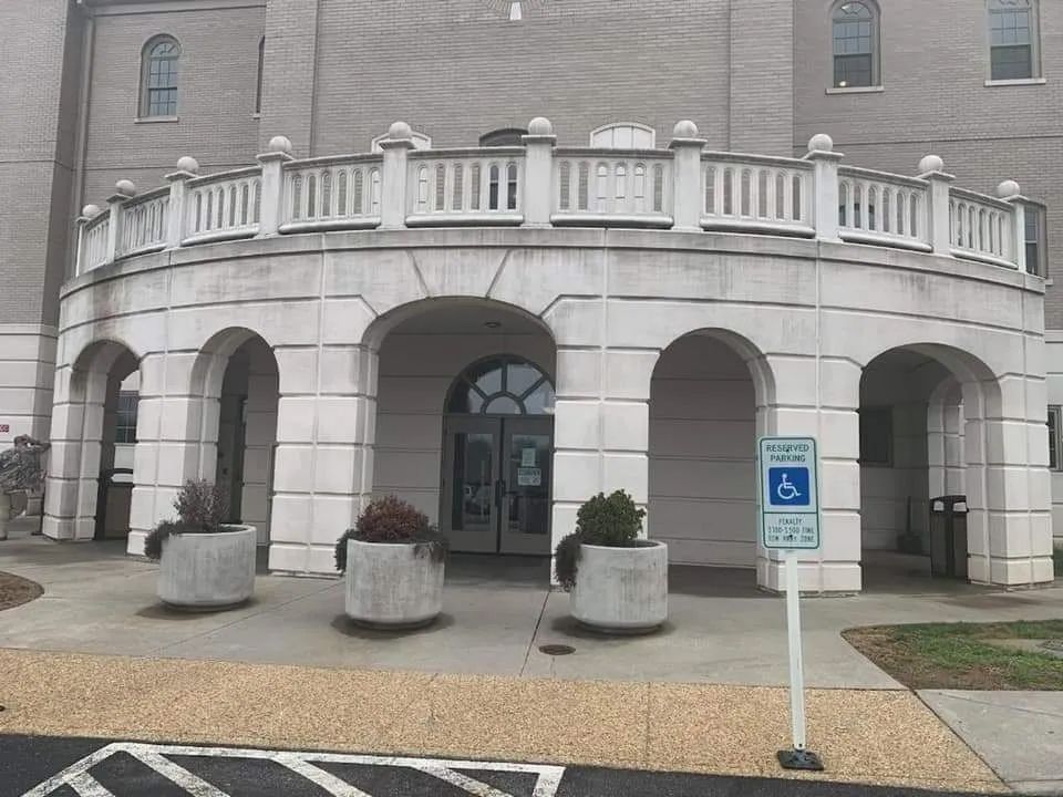 a building with a handicapped parking sign in front of it