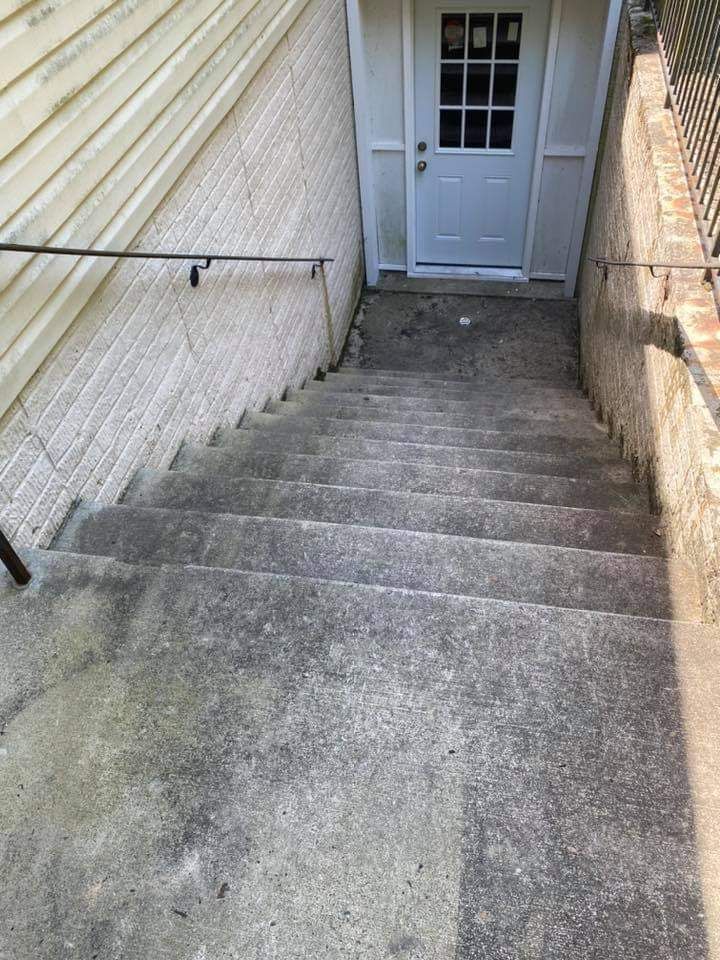 a set of stairs leading up to a basement door