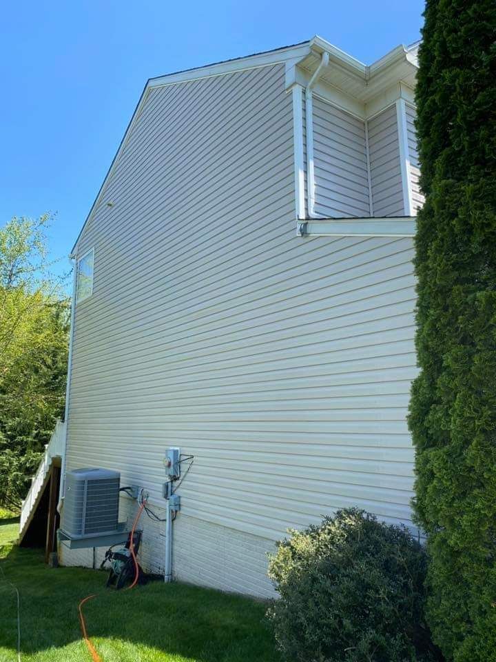 a white house with a blue sky in the background