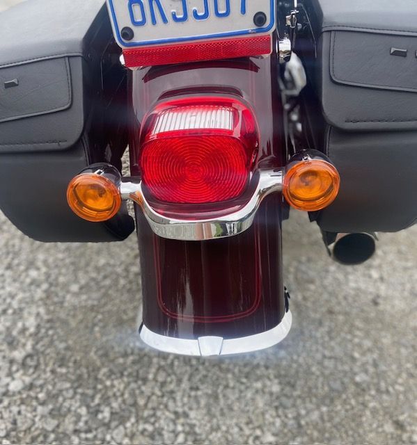 A close up of a motorcycle with a license plate that says ok 3j07