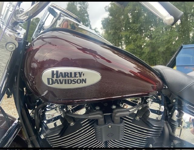 A harley davidson motorcycle is parked in a parking lot