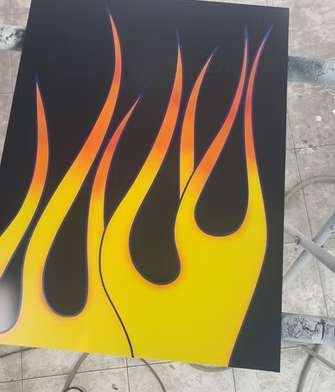 A painting of flames on a black background