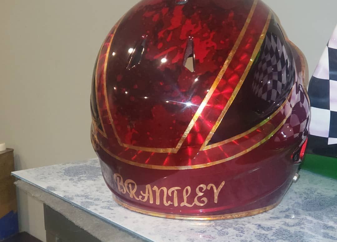 A red helmet with the name branley on it