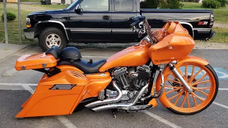 Two motorcycle tanks with skulls painted on them