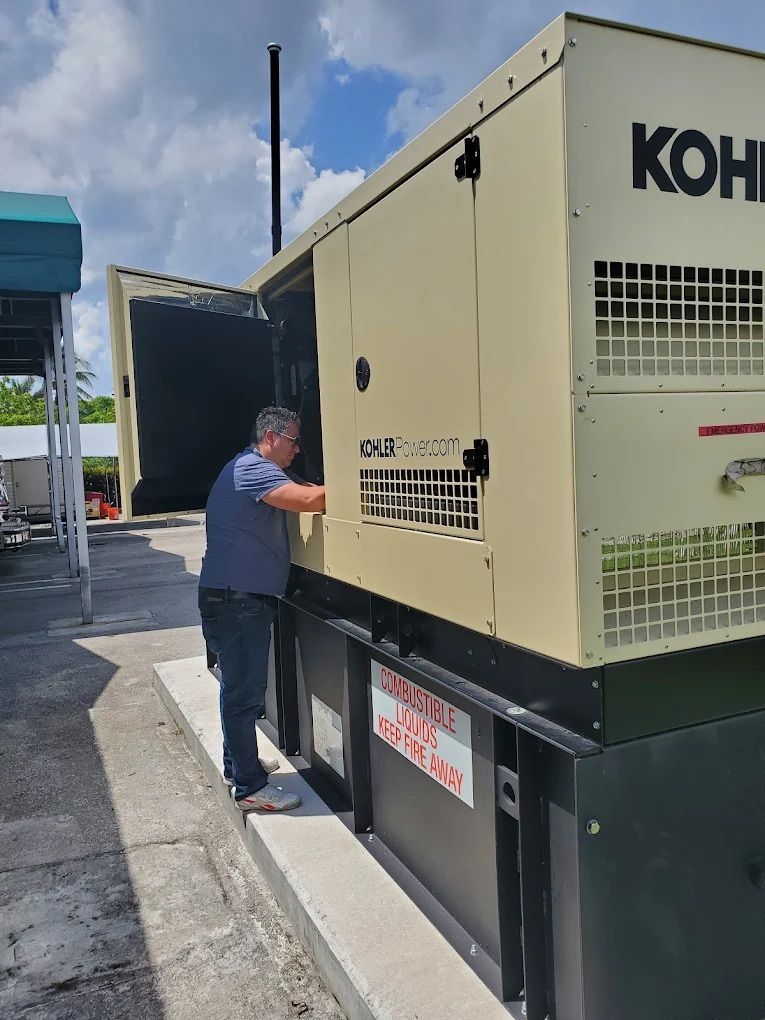 Man inspecting a beige Kohler generator outside, under a partly cloudy sky.