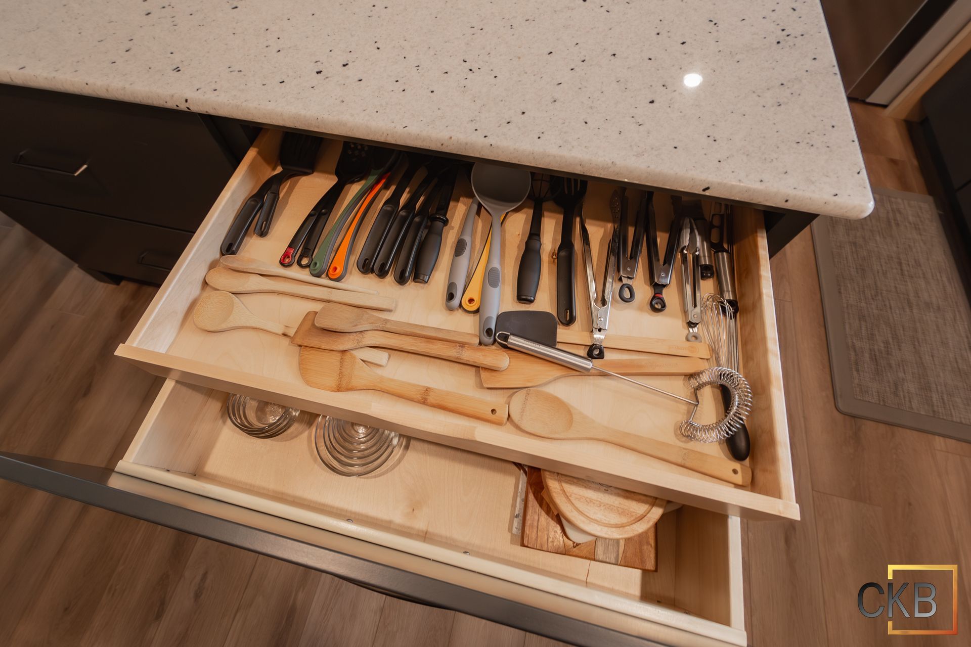 A kitchen drawer filled with utensils and cooking utensils