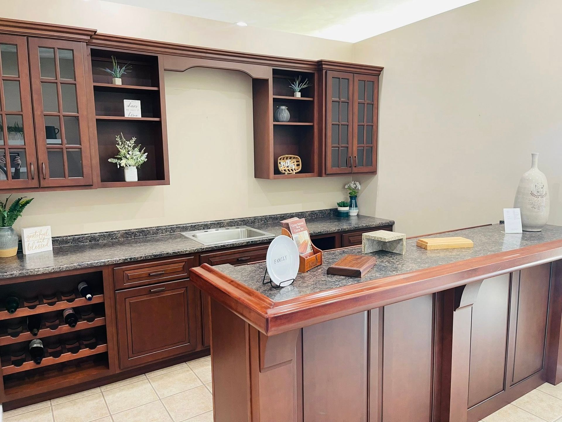 A kitchen with wooden cabinets and granite counter tops