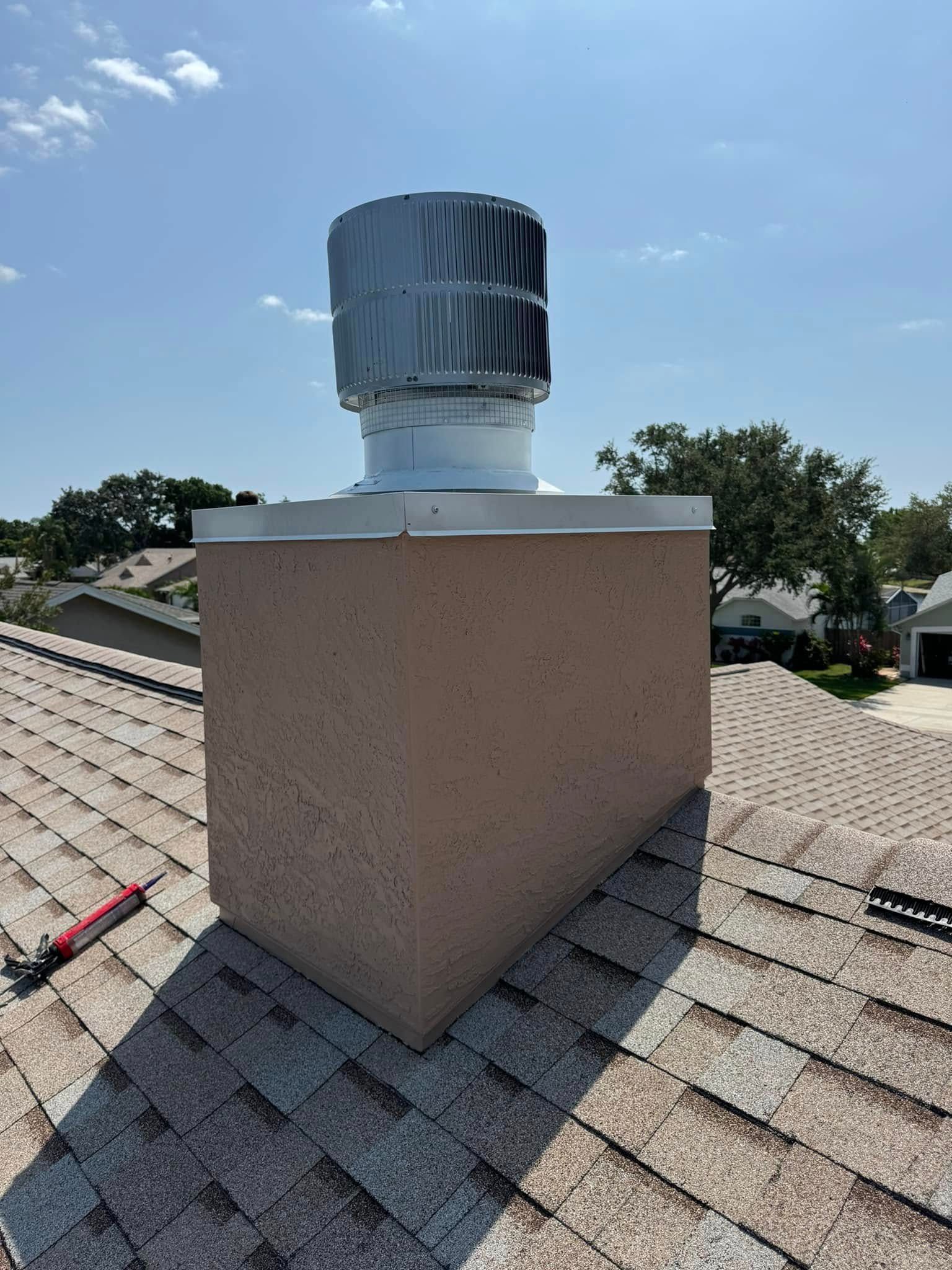 A chimney is sitting on top of a roof.