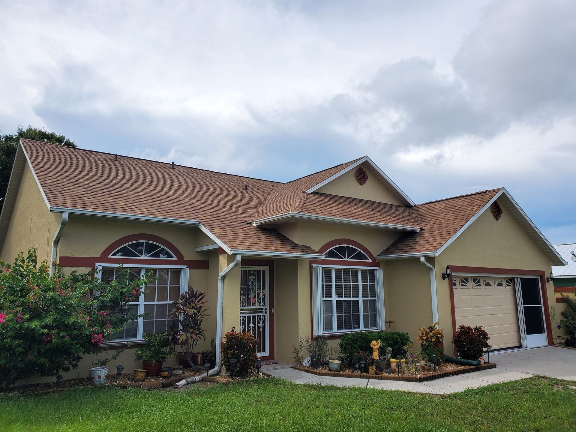 A house with a brown roof and a lot of windows