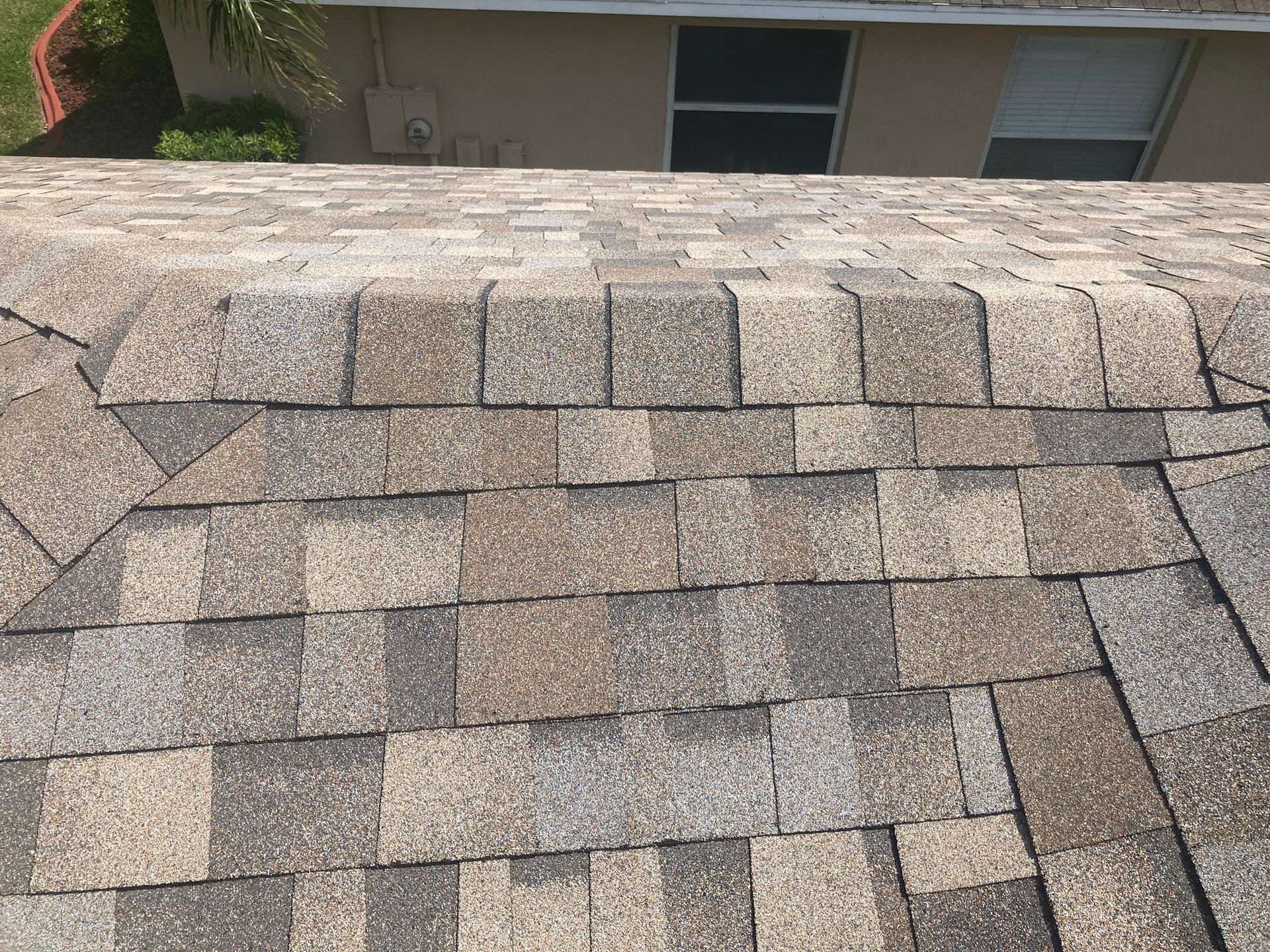 A close up of a roof with a lot of shingles on it.