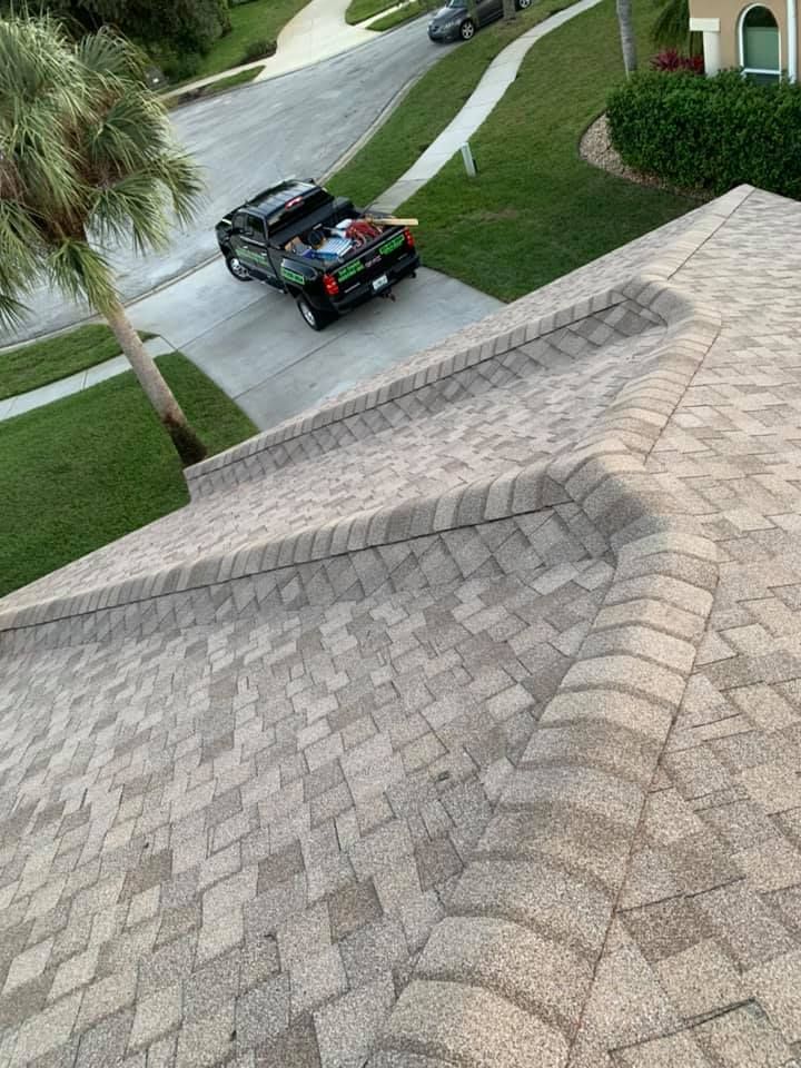 A truck is parked on the roof of a house.