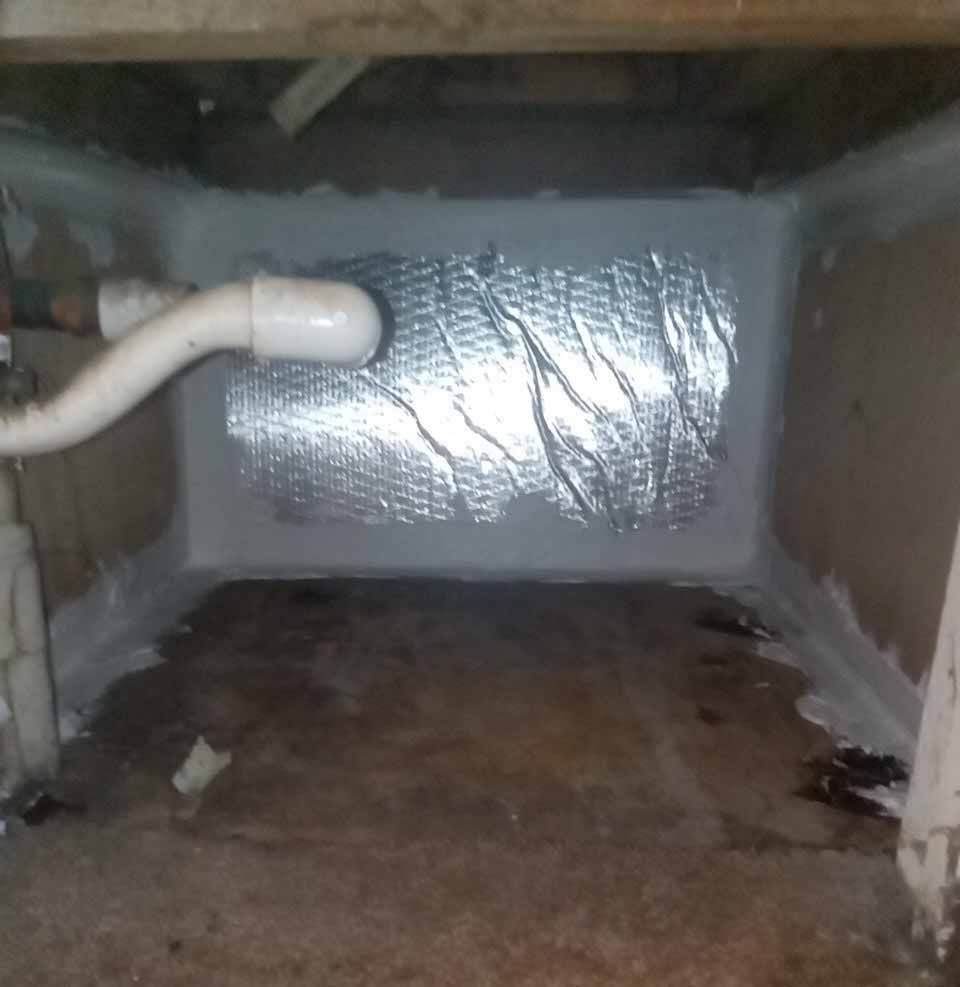 There is a pipe in the corner of the room.