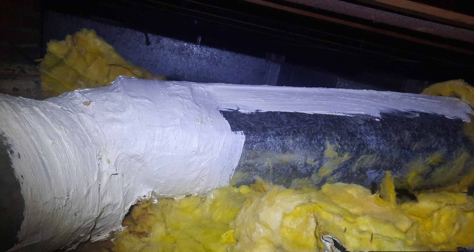 A close up of a pipe with insulation on it.