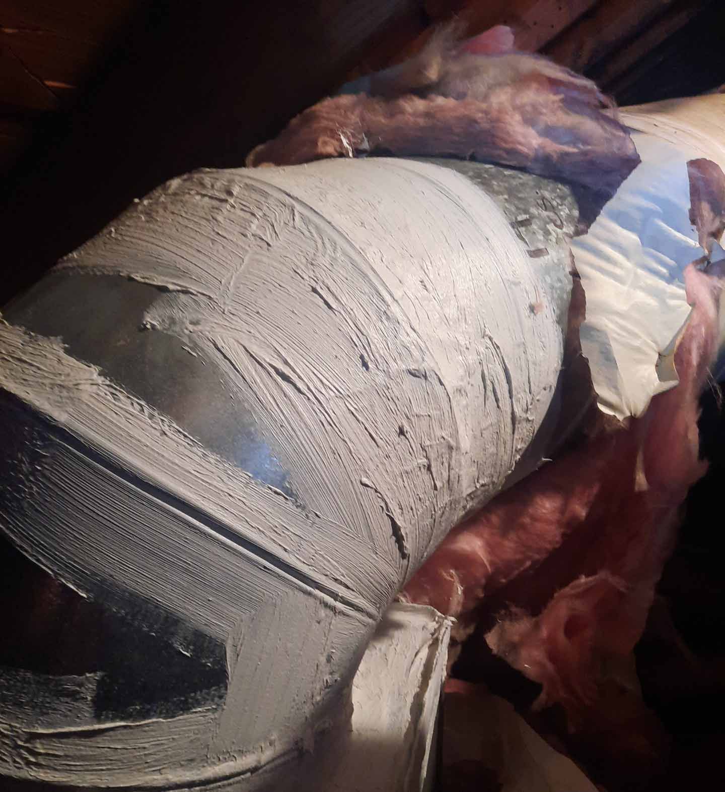 A close up of a pipe with insulation on it