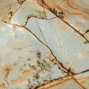 Stone slab with light blue, brown, and tan marbling and dark veining.
