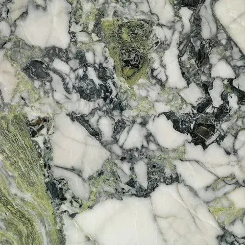 White marble with green and dark gray veining.