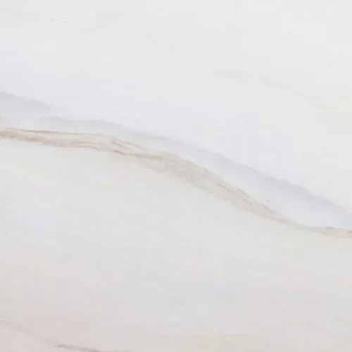 White marble surface with subtle, light brown veining.