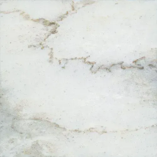 White marble tile with brown veining.