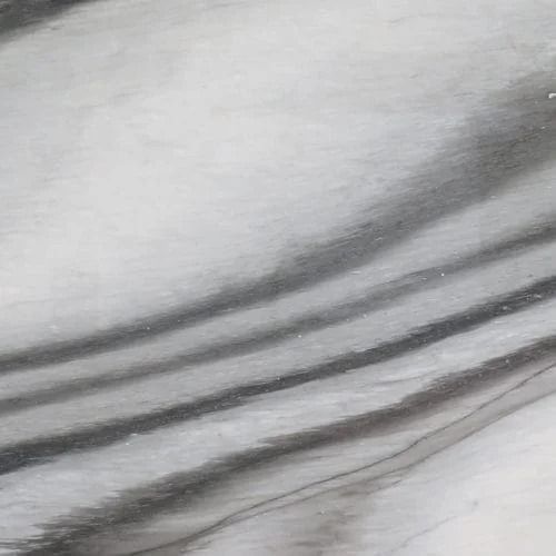 White and gray marble with dark gray, flowing veins.