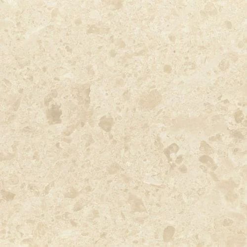 Cream-colored marble surface with mottled and speckled pattern.