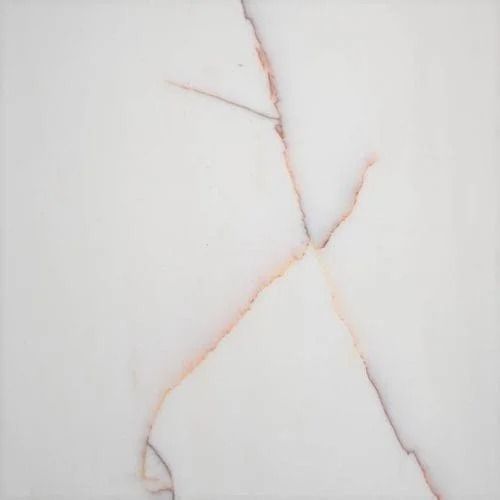 White tile with pinkish-brown veining creating an abstract pattern.