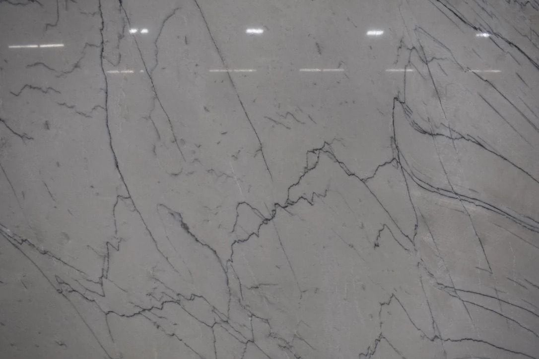 White marble slab with gray veining.